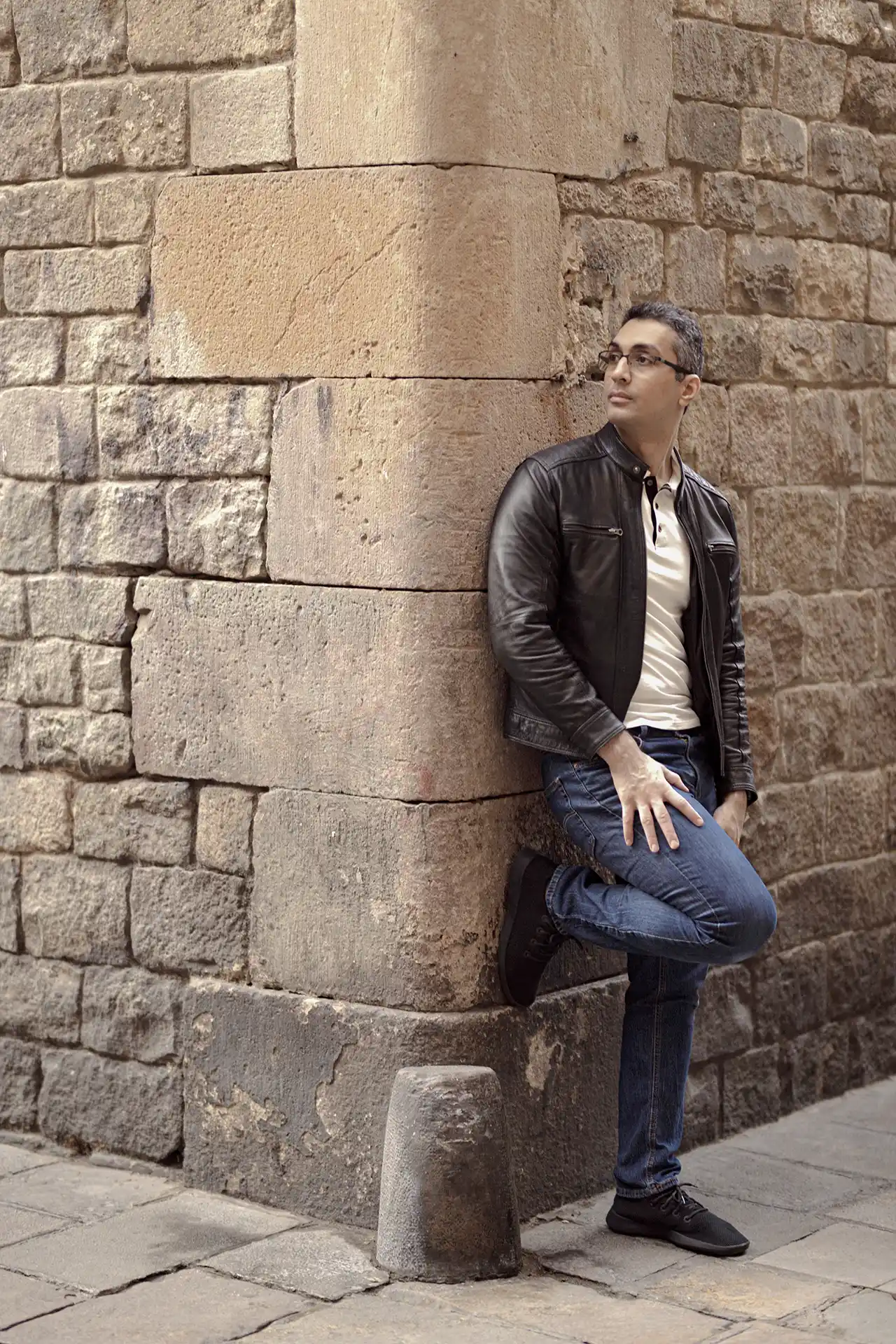 Amr Elnahla standing in Barcelona’s old city. In narrow streets, corners were reinforced with stone, rounded to withstand contact with passing carts.
